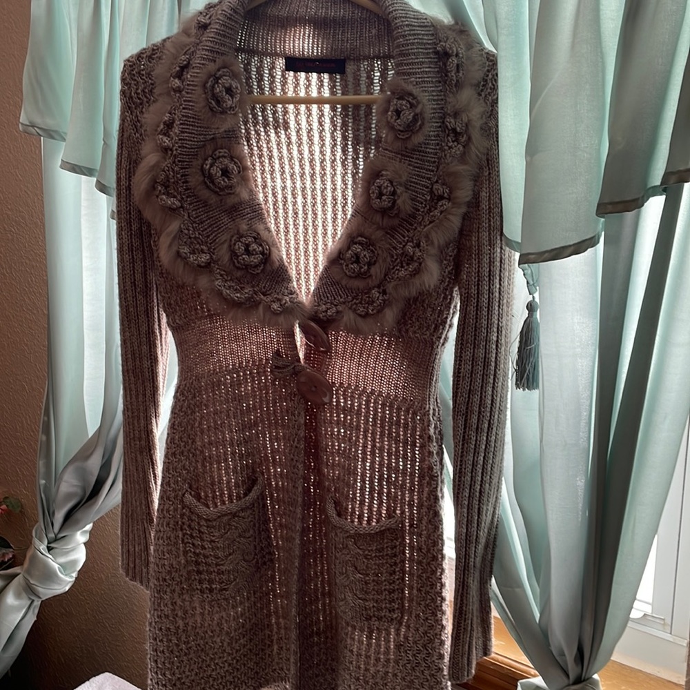 Marbled tan and crème rabbit embellished, cable knit cardigan.